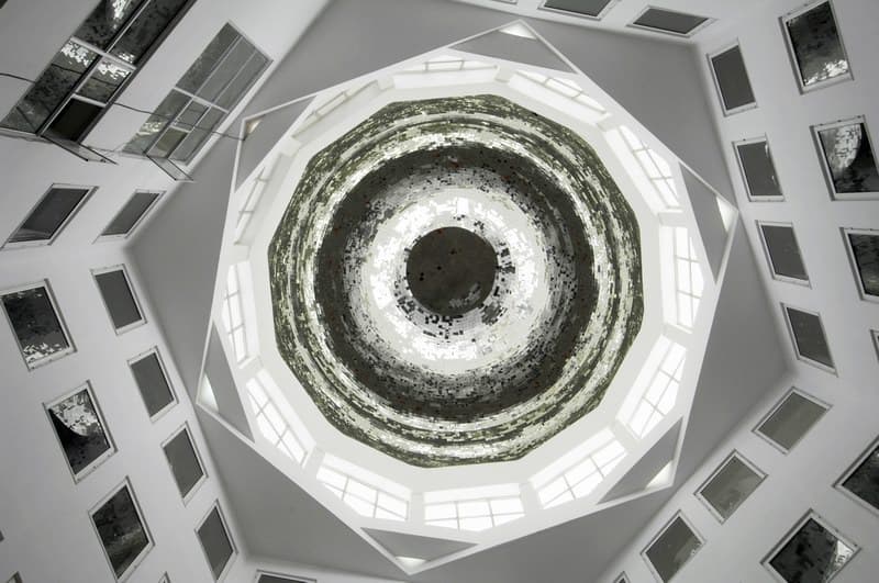 Hospital atrium with natural light and stained glass